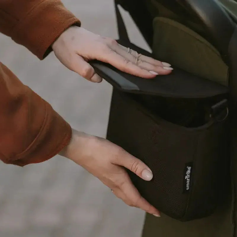 Which three pushchair organiser clasps can you open one-handed and still trust?